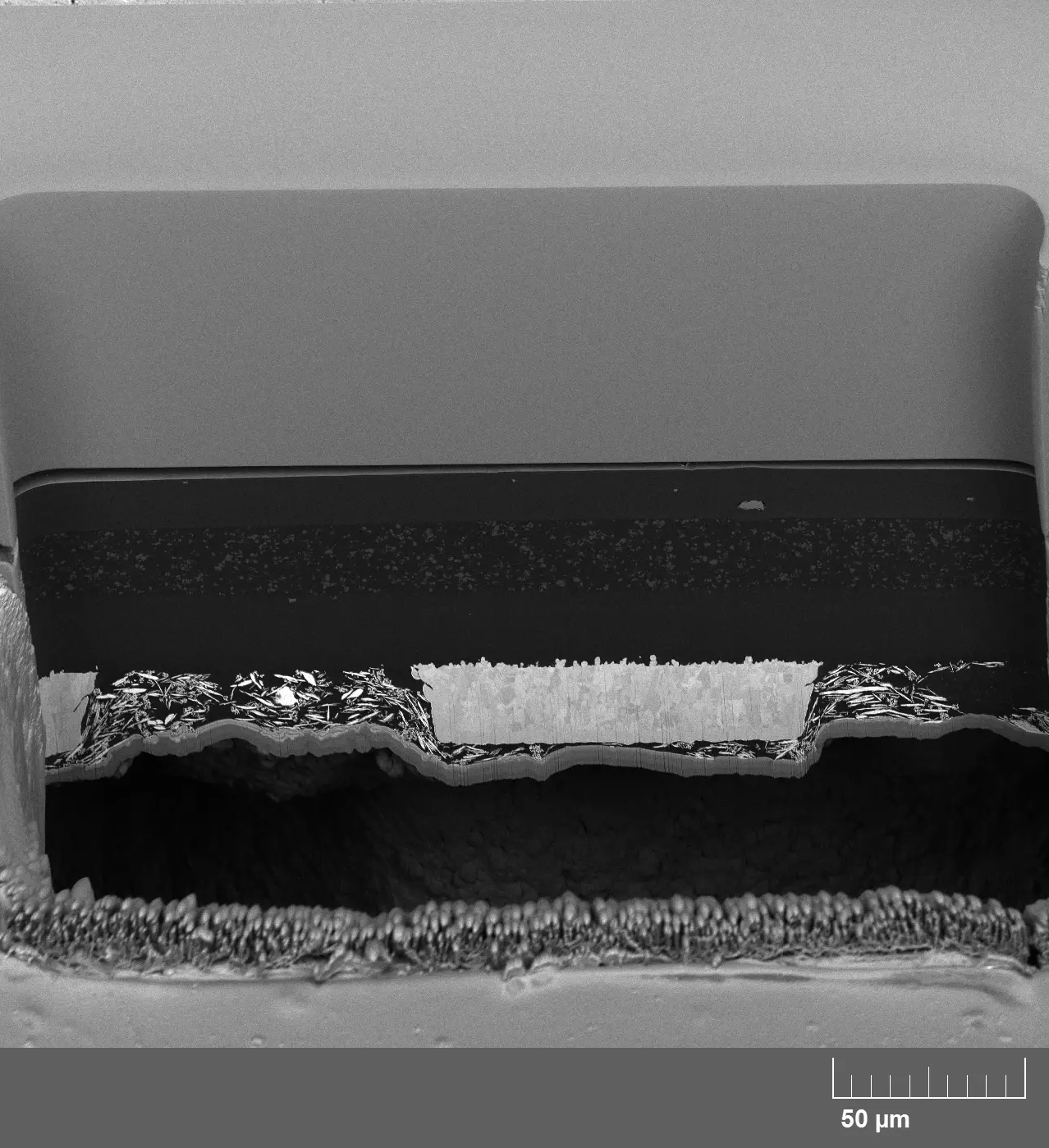 Reveal Defects in OLED Devices with Mask-Based Cross-Sectioning