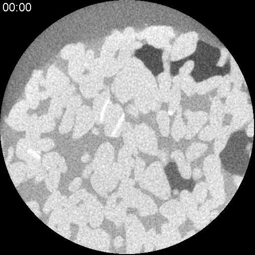Dynamic CT of multiphase flow. Drainage process, non-wetting phase moving into the pore space