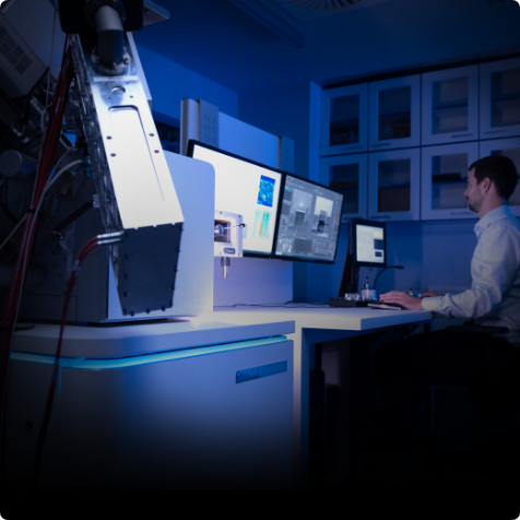 Researcher with TESCAN AMBER X for battery material analysis