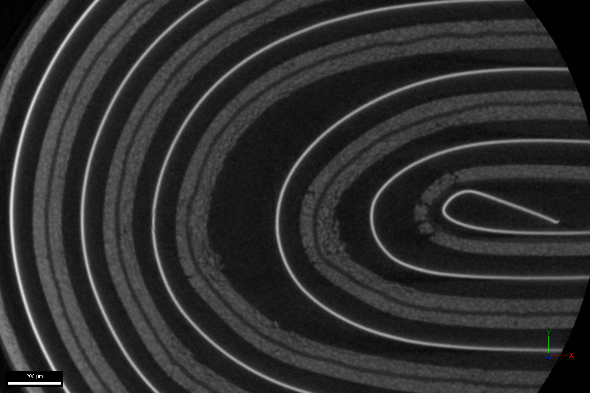 Tescan UniTOM XL virtual micro-CT slice through a pouch cell highlighting internal cracks