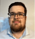 A person with a beard and glasses

Description automatically generated, Picture